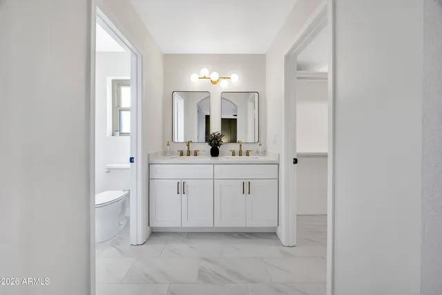 a bathroom with a shower a toilet and a window