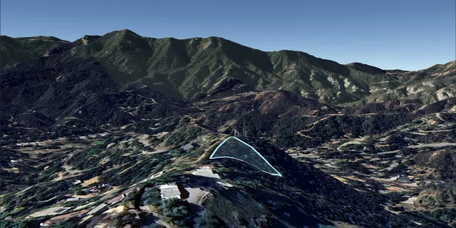 a view of houses with a street