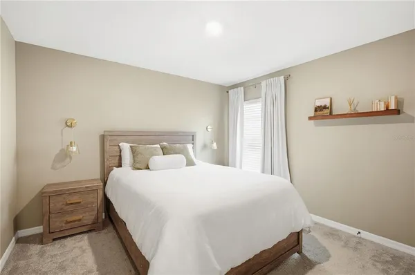 a bedroom with a bed and a closet