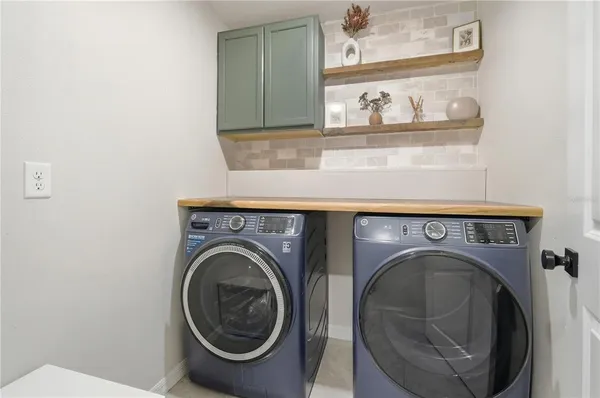 a utility room with dryer and washer