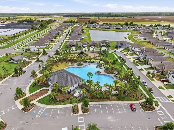 an aerial view of residential building and lake