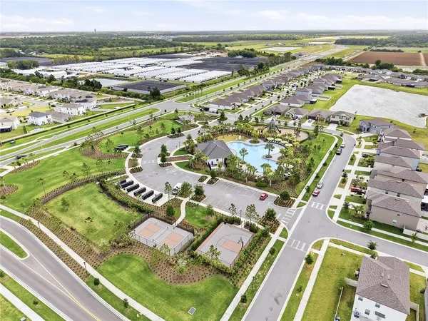 an aerial view of residential houses with outdoor space