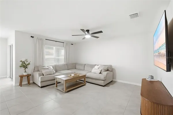 a living room with furniture and a window