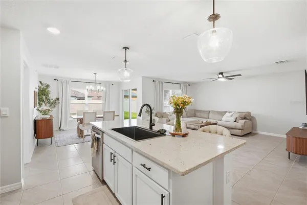 a kitchen with sink cabinets and window