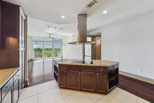 a kitchen with a stove a sink and a refrigerator