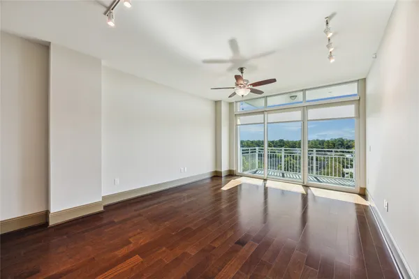 a view of wooden floor and windows in a room