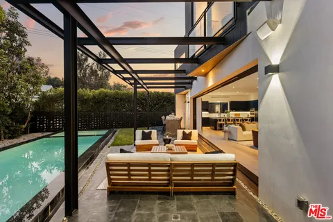 a view of swimming pool with a patio