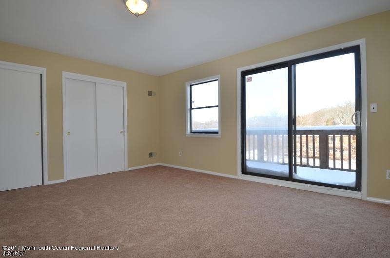5 D Brookside Heights, Unit 102 Wanaque, NJ 07465 - Photo 12 of 15 a view of an empty room with a window
