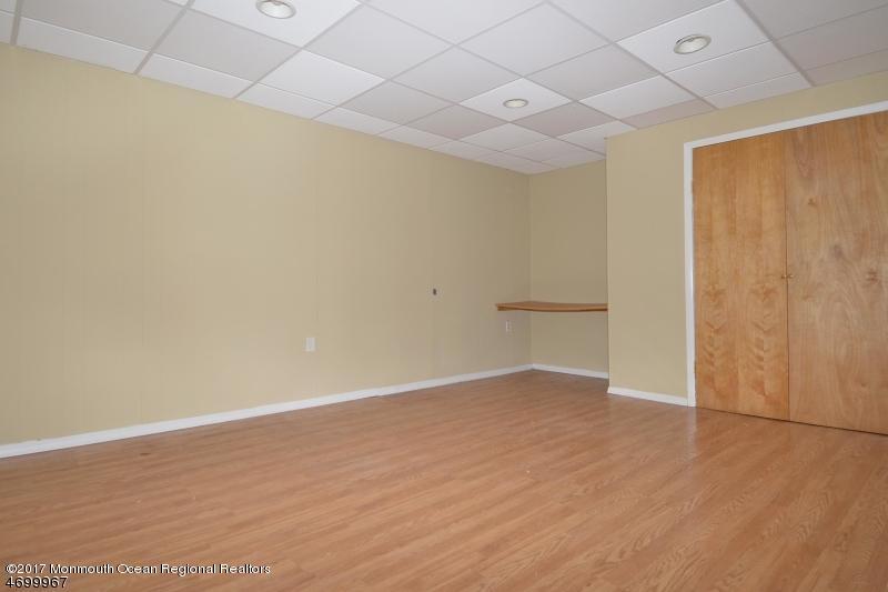 5 D Brookside Heights, Unit 102 Wanaque, NJ 07465 - Photo 14 of 15 a view of an empty room with wooden floor and a window