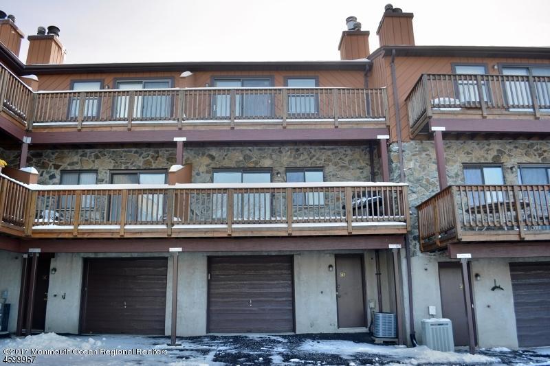 5 D Brookside Heights, Unit 102 Wanaque, NJ 07465 - Photo 2 of 15 a front view of a building with balcony