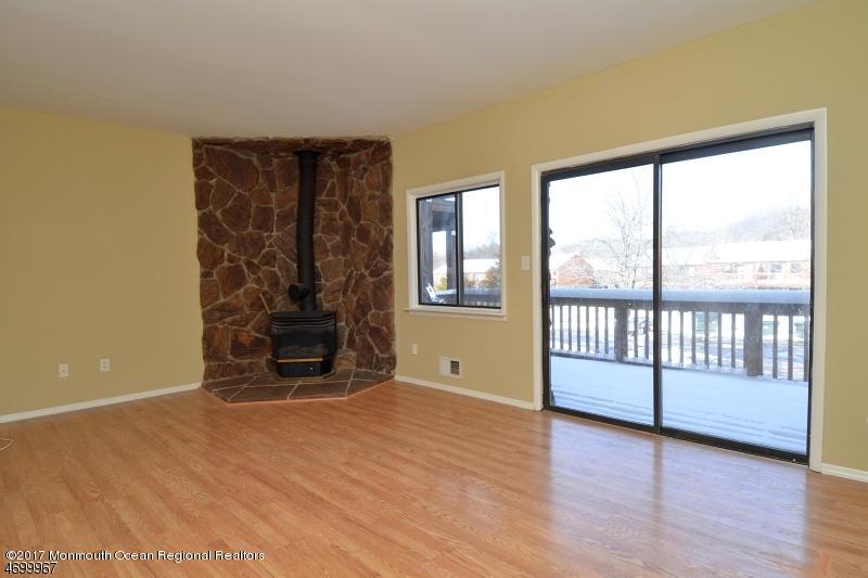 5 D Brookside Heights, Unit 102 Wanaque, NJ 07465 - Photo 7 of 15 wooden floor in an empty room with a window