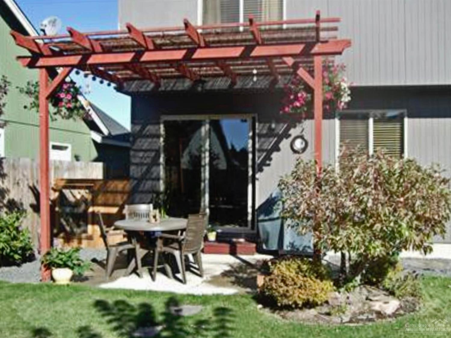 20584 Dylan Loop Bend, OR 97702 - Photo 9 of 20 Concrete patio and pergola off sliders f