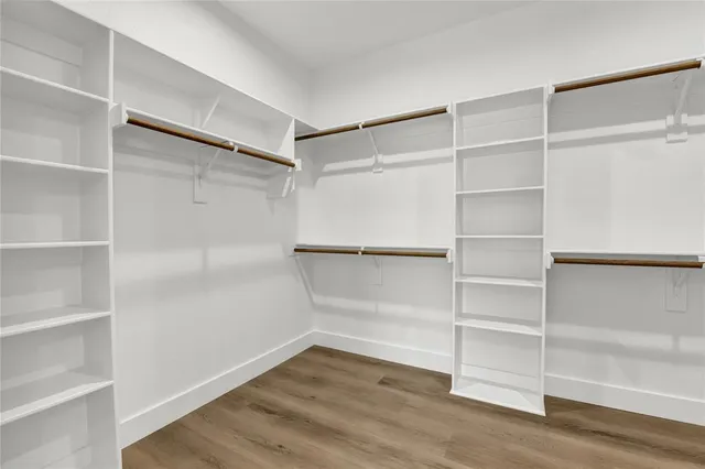 a view of an empty walk in closet