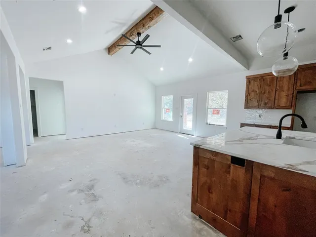 a kitchen with a sink stainless steel appliances and cabinets