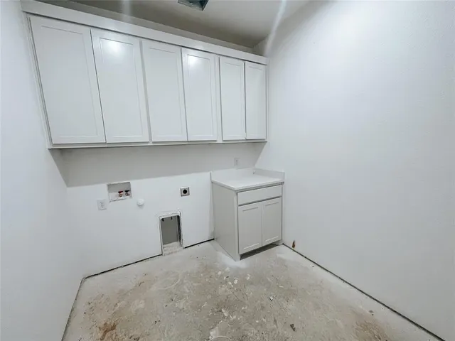 a view of storage and utility room with empty racks