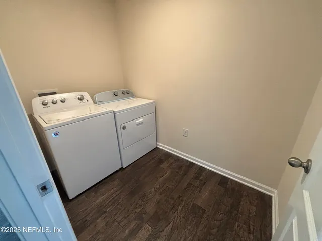 a utility room with dryer and washer