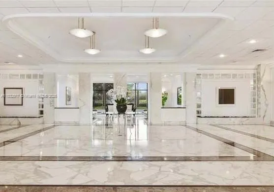 a view of a living room and kitchen