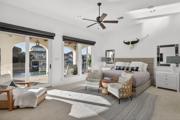 a bedroom with furniture and a large mirror