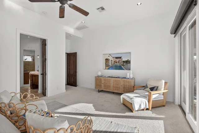 a spacious bathroom with a tub shower and mirror