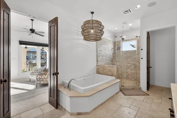 a large kitchen with kitchen island a sink stainless steel appliances and cabinets