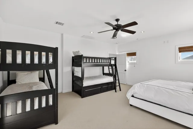 a bedroom with furniture and a window