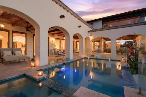 a view of swimming pool with outdoor seating