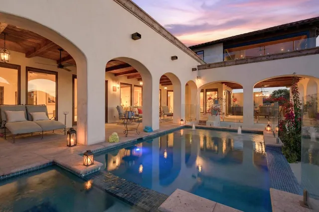 a view of swimming pool with outdoor seating