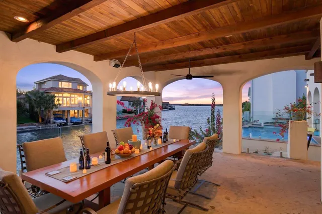 a dining room with furniture and a chandelier