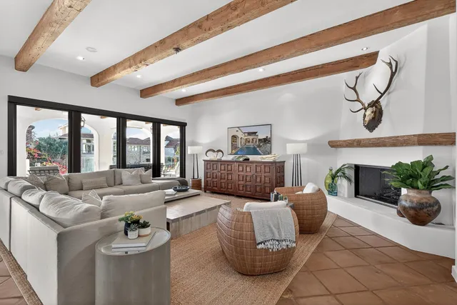 a living room with furniture and fireplace