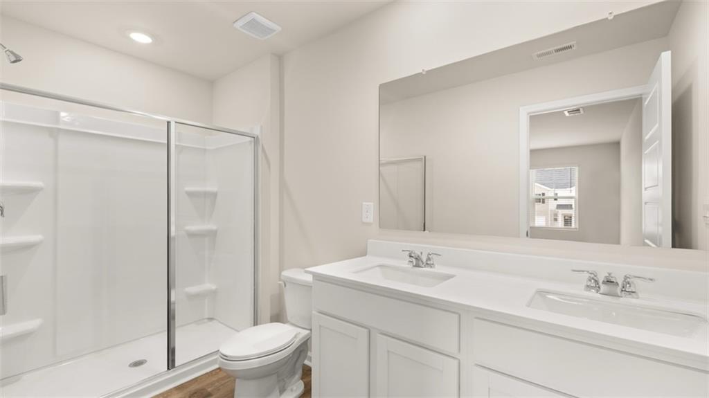 208 Kenmore Circle Perry, GA 31069 - Photo 3 of 6 a bathroom with a sink toilet and shower