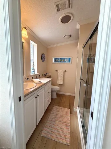 a bathroom with a sink a mirror and a shower