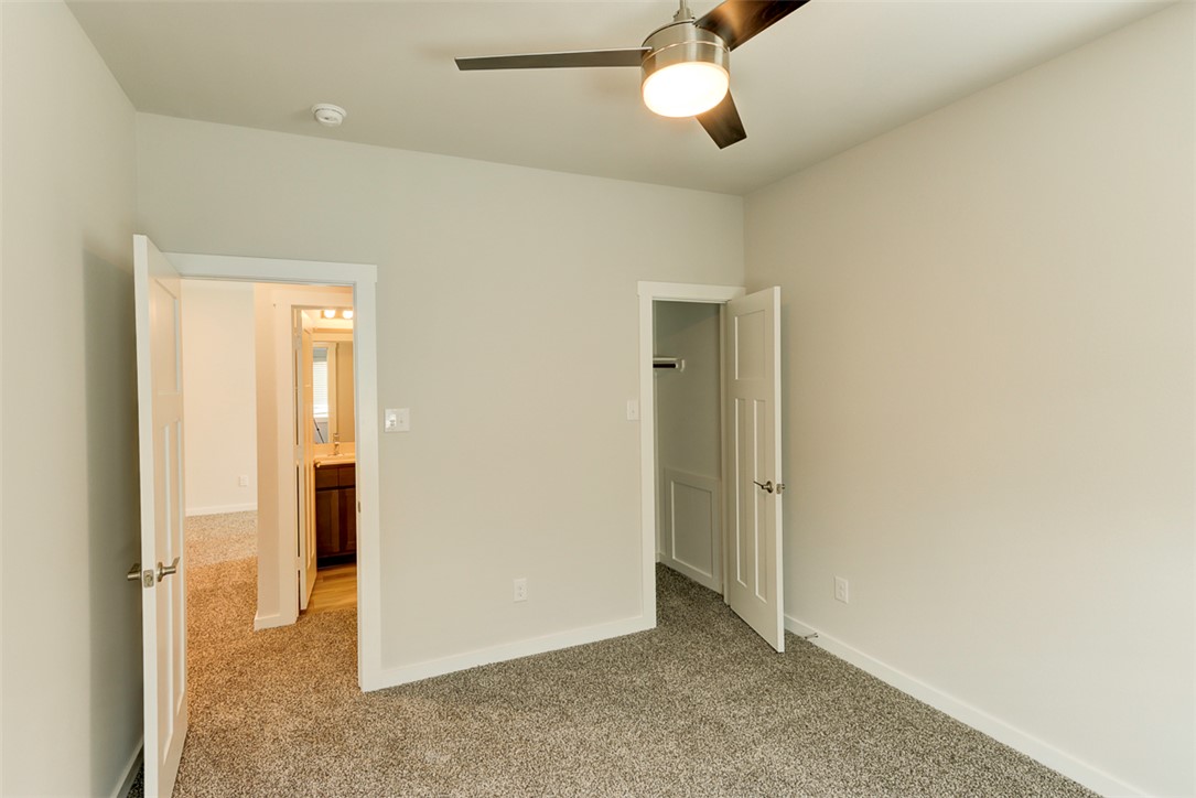760 Double Mountain Road College Station, TX 77845 - Photo 21 of 26 an empty room with chandelier fan
