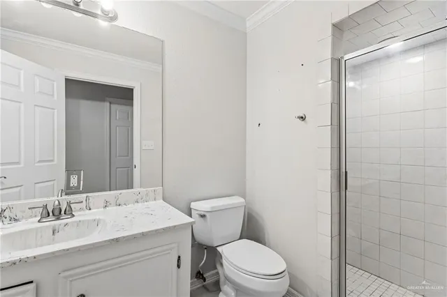 a bathroom with a granite countertop toilet a sink and a mirror