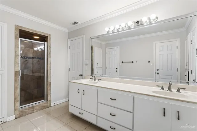 a bathroom with a sink double vanity and a mirror