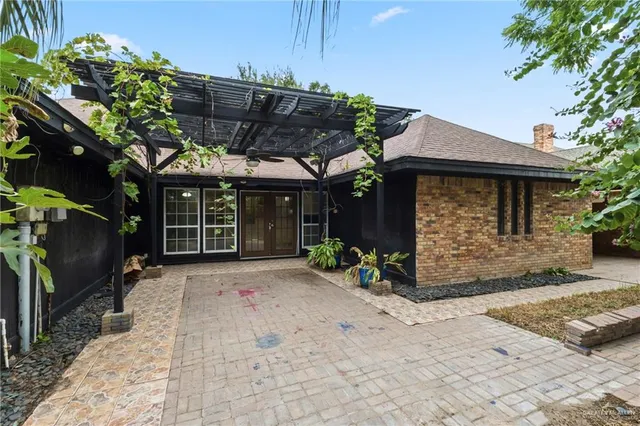 a view of a car park in front of a house