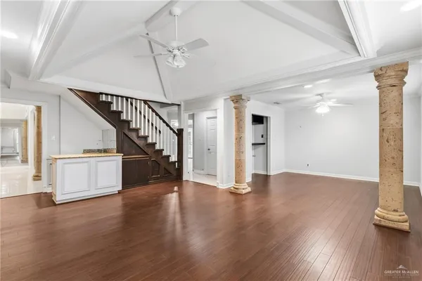 a view of an entryway with wooden floor