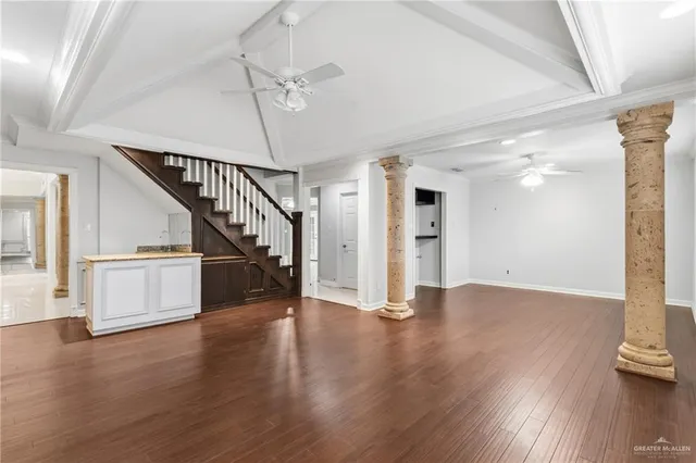 a view of an entryway with wooden floor