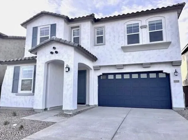 a front view of a house with yard
