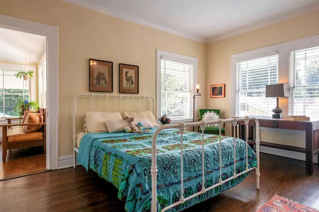 a bedroom with a bed and a couch