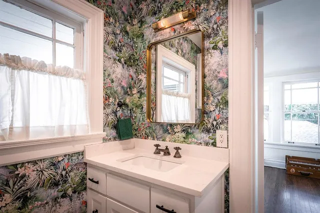 a bathroom with a sink and a mirror