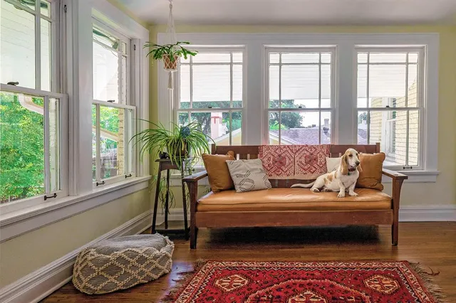 a view of pool with large trees and a big yard with swimming pool in front of house