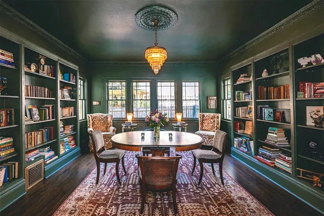 a dining room with furniture and chandelier