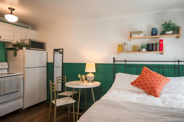 a kitchen with a sink cabinets and a stove top oven