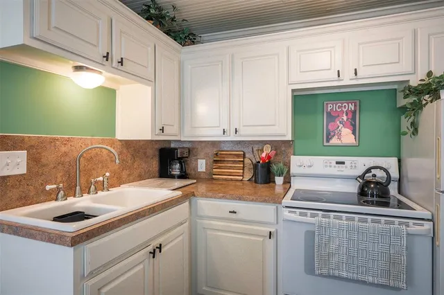 a bathroom with a sink a mirror and a shower