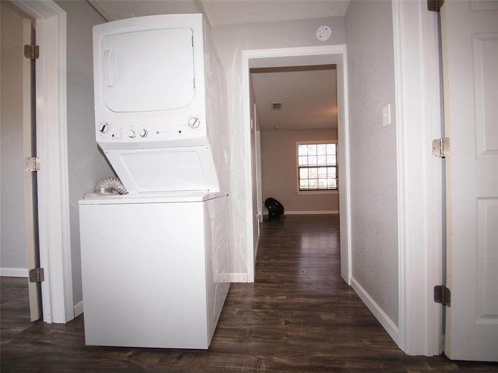 1327 Old Jacksboro Road Graham, TX 76450 - Photo 16 of 33 a view of utility room with washer and dryer