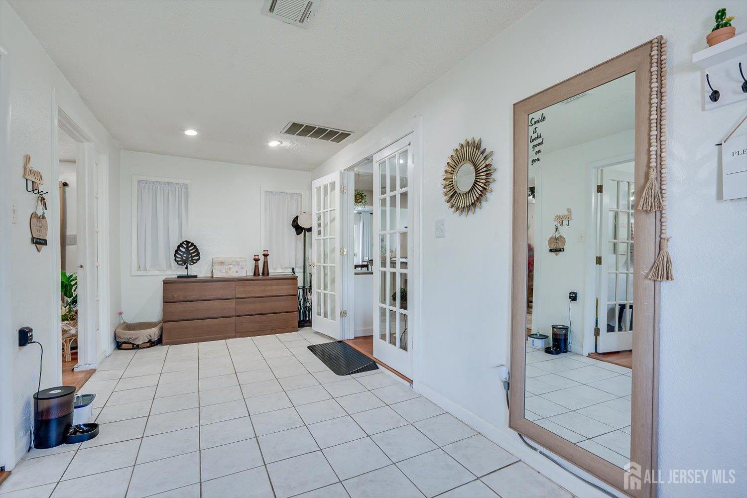 15 Markham Road Edison, NJ 08817 - Photo 5 of 32 a bedroom with a bed and a mirror