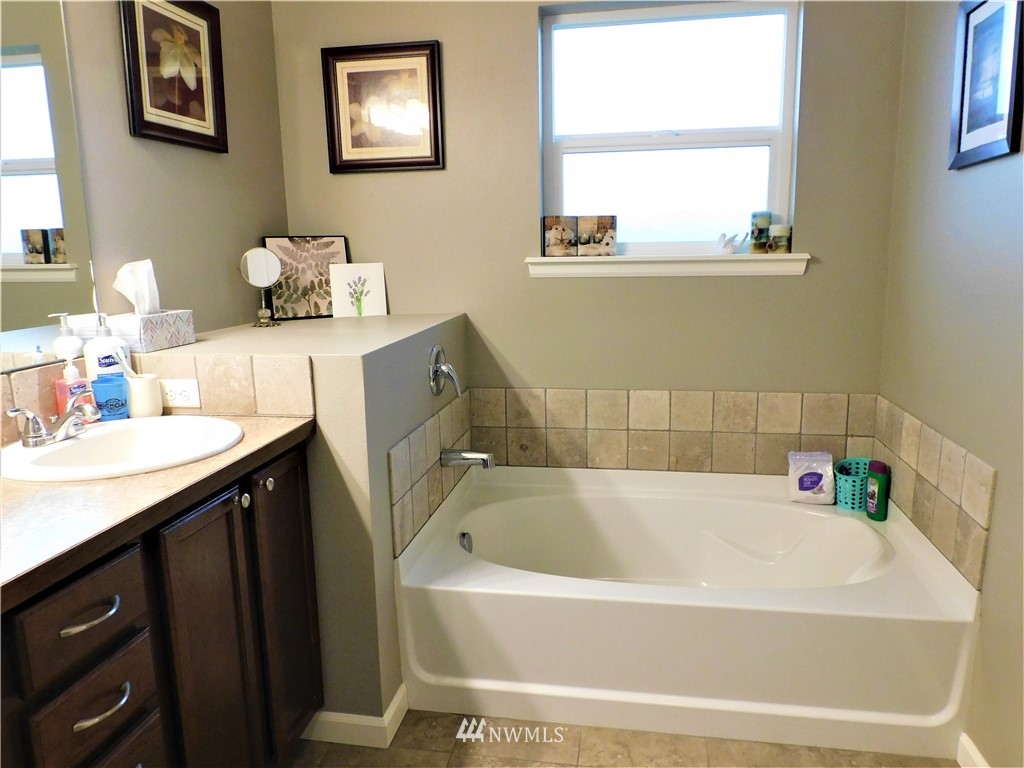231 Sharp Road Tieton, WA 98947 - Photo 12 of 27 a white bath tub sitting next to a bathroom sink