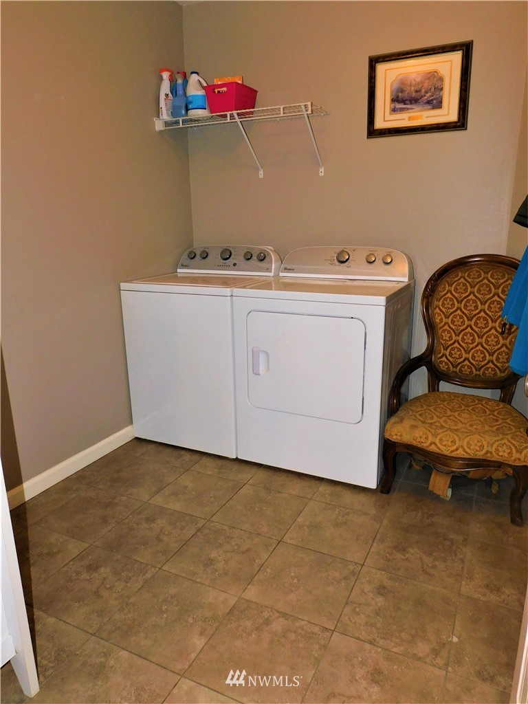 231 Sharp Road Tieton, WA 98947 - Photo 13 of 27 a utility room with a sink a washer and dryer