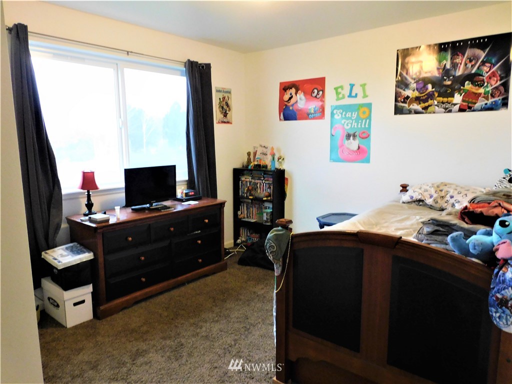 231 Sharp Road Tieton, WA 98947 - Photo 14 of 27 a bedroom with a bed and furniture
