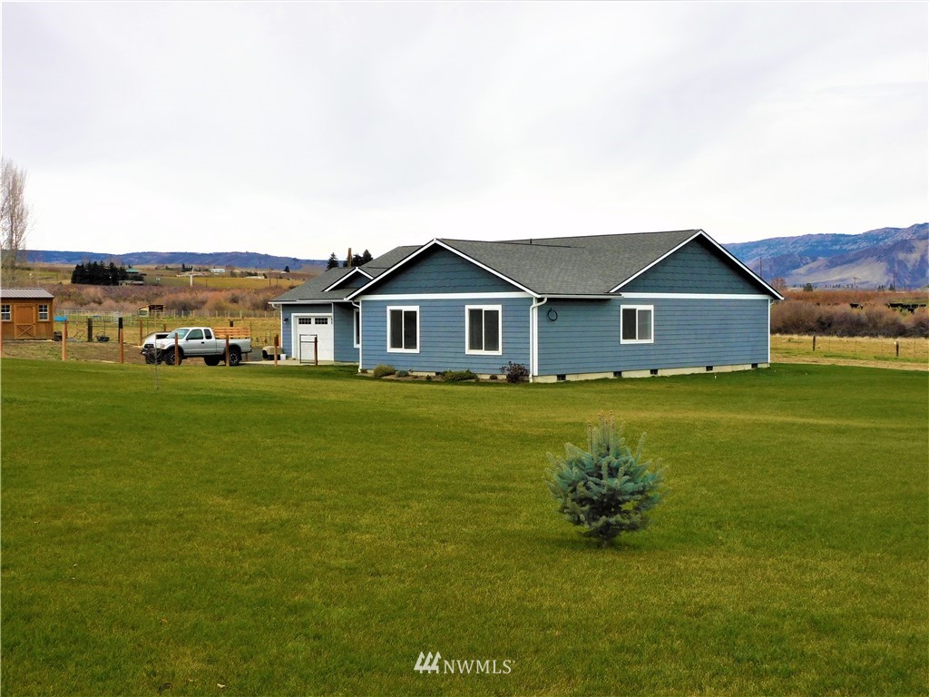 231 Sharp Road Tieton, WA 98947 - Photo 26 of 27 a front view of a house with garden